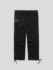 COMME des FUCKDOWN PANTALONE CON NERVATURE E STAMPA • NERO